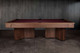 Side view of the Arthur Deco solid walnut pool table featuring bold Art Deco pedestal legs and premium burgundy felt Side view of the Arthur Deco solid walnut pool table featuring bold Art Deco pedestal legs and premium burgundy felt